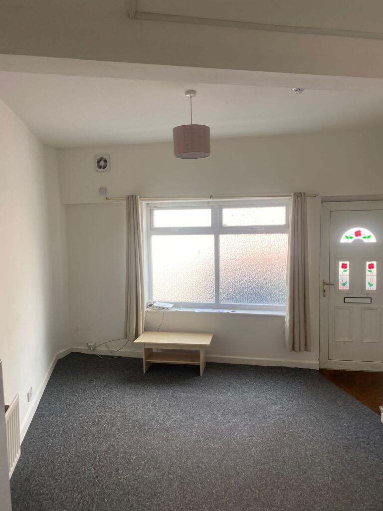 A bright and airy living room featuring a large...