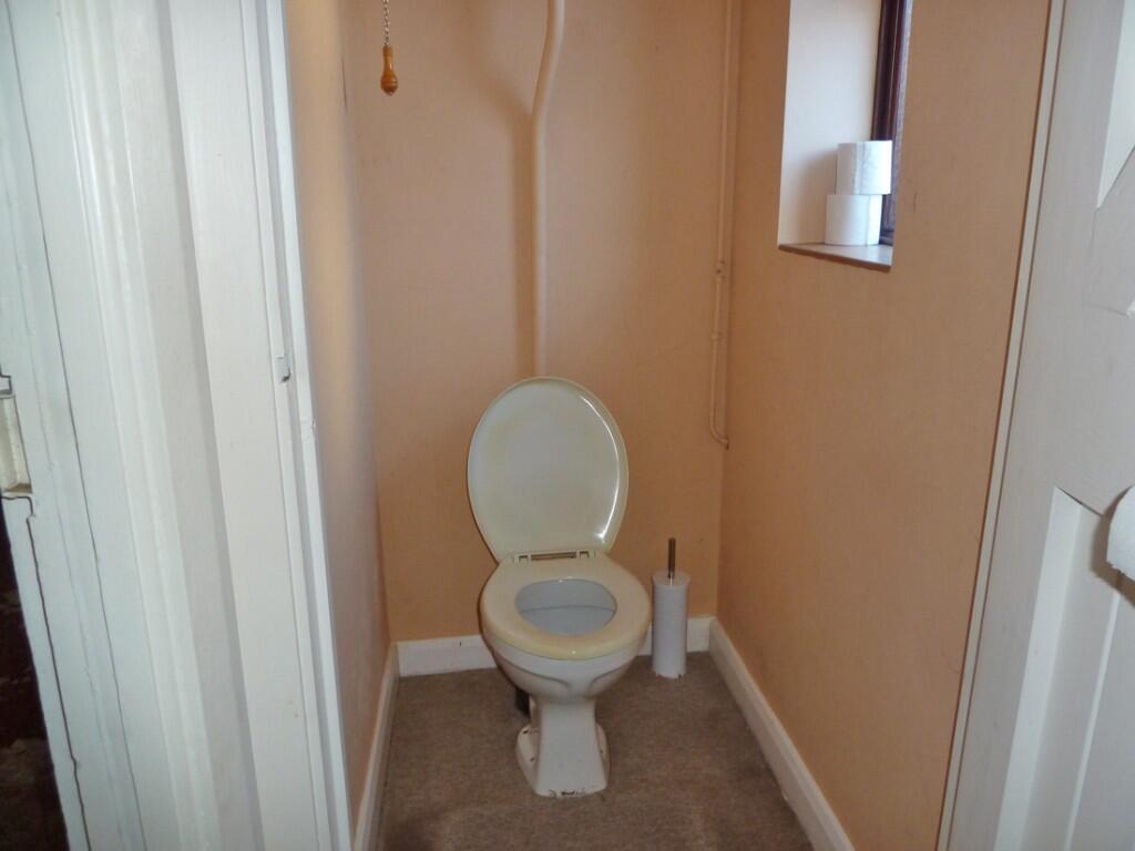 Toilet off rear hall