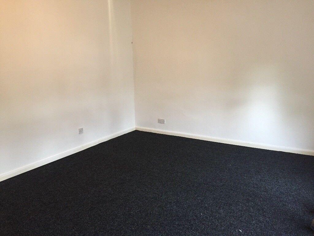 Bright, freshly painted room with neutral walls...