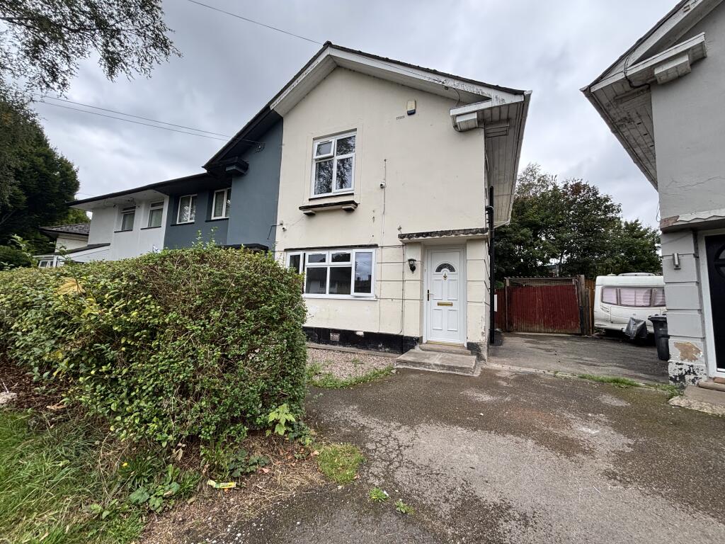 Front with gate to Car port