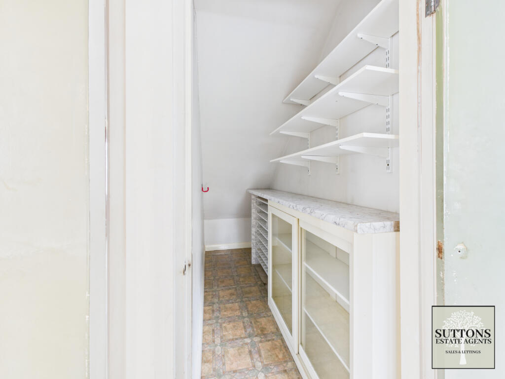 Pantry under stairs