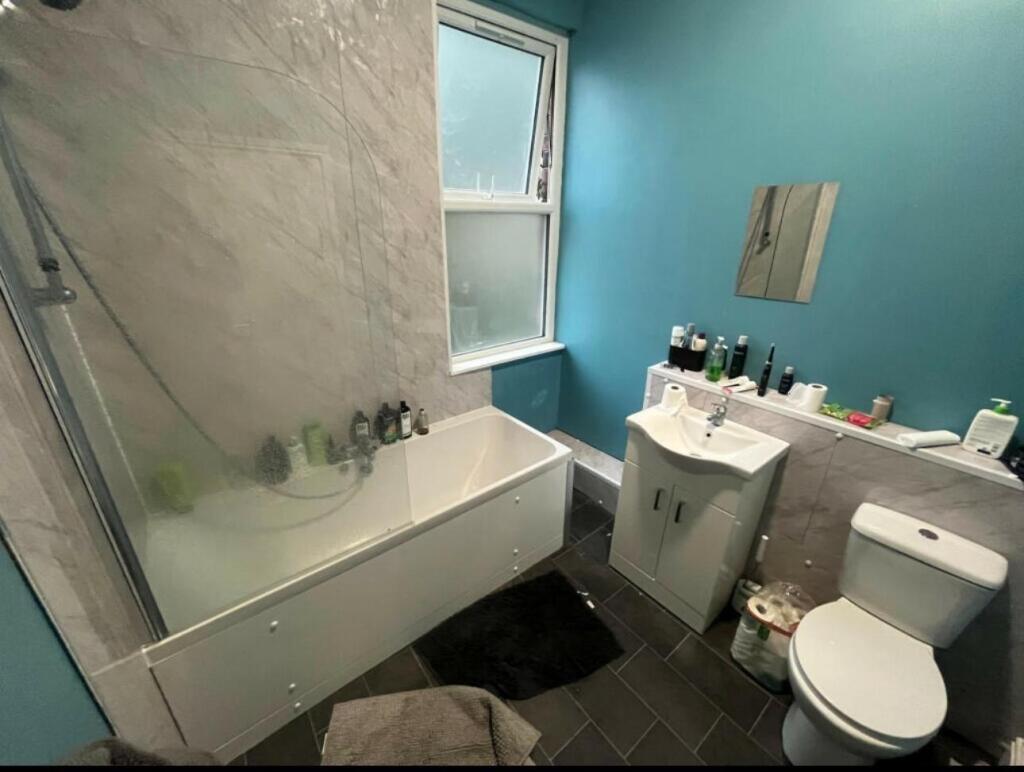 A clean and well-maintained bathroom featuring ...