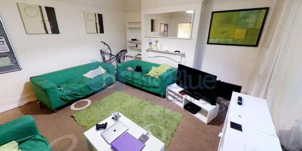 A bright and inviting living room featuring com...