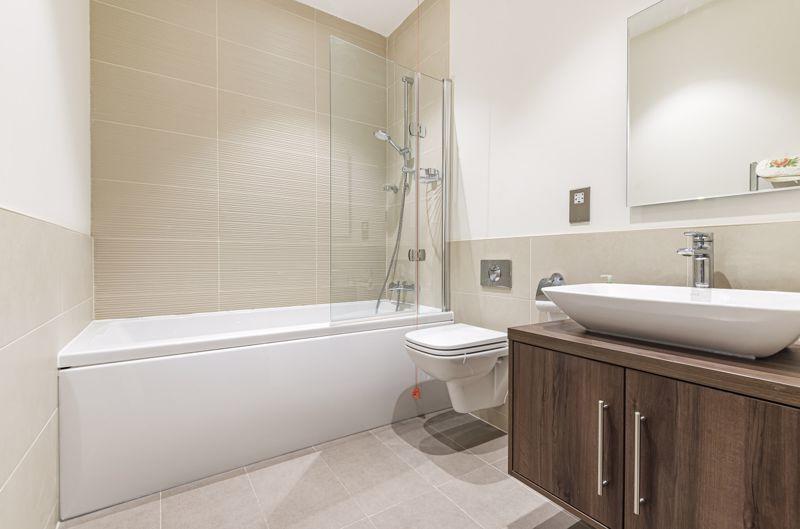 Bathroom with over-bath shower