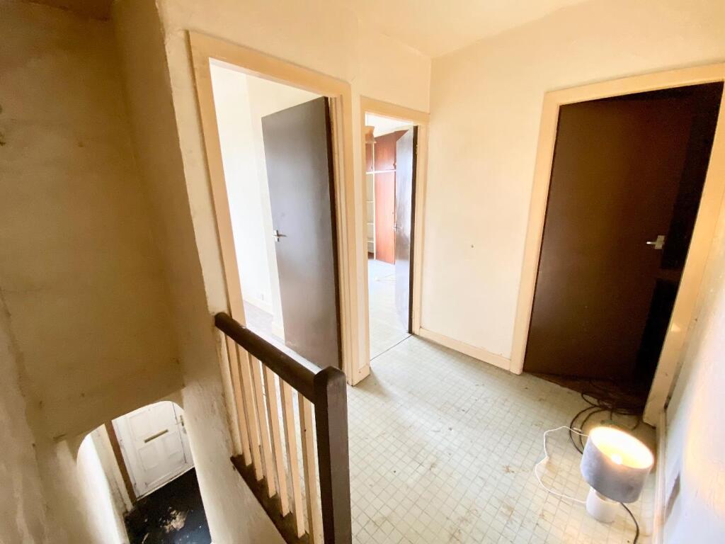 TO THE FIRST FLOOR LANDING