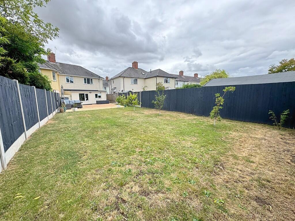 Rear garden to ex...