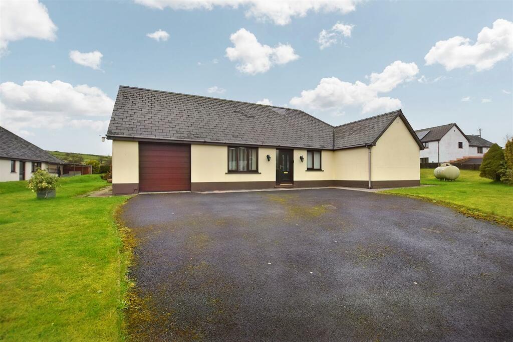 Front of Property + Parking Area