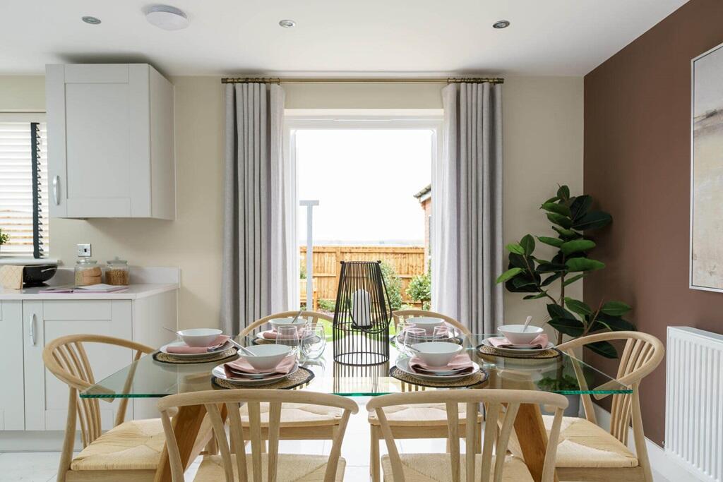 Double doors lead from the dining area to the garden