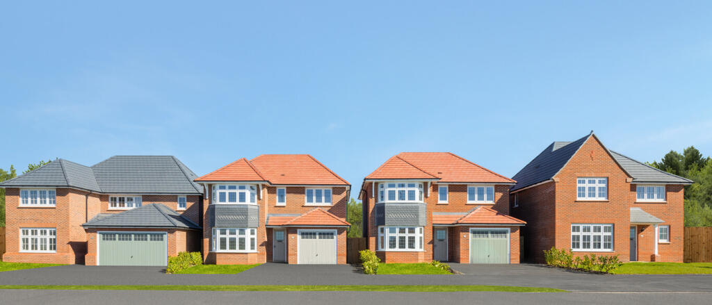 A row of modern detached houses with brick exteriors, bay windows, and colourful roofs under a clear