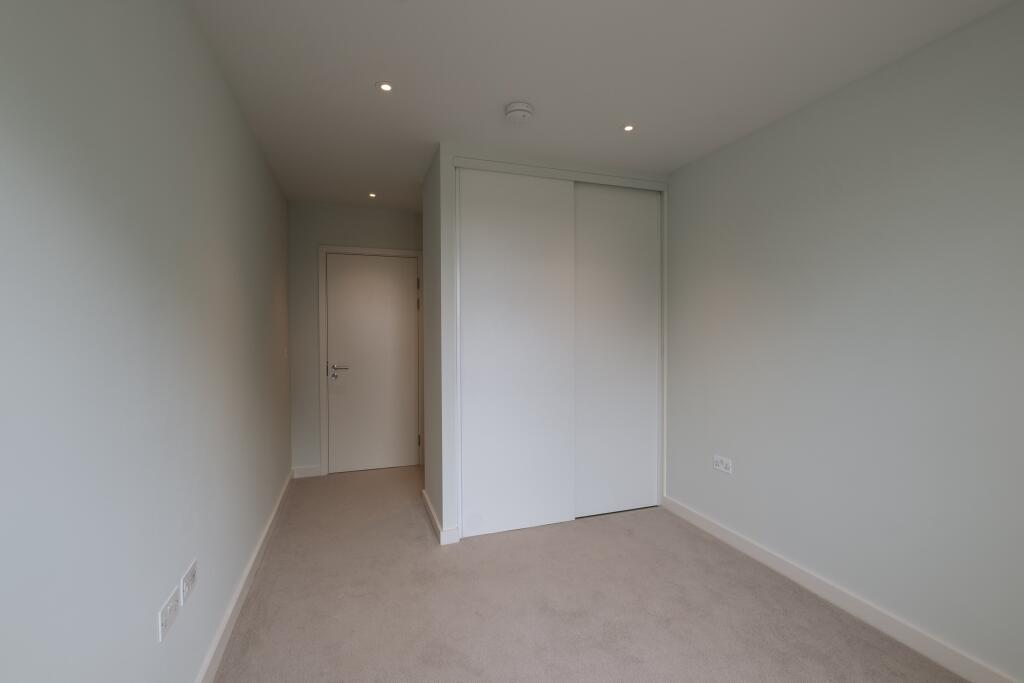 Experience serenity in this minimalist bedroom corner designed for peaceful living.