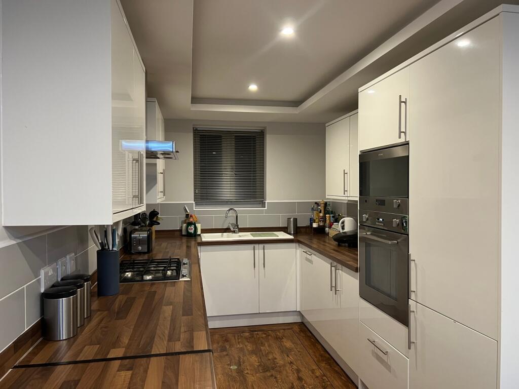 A modern and stylish kitchen with ample storage...