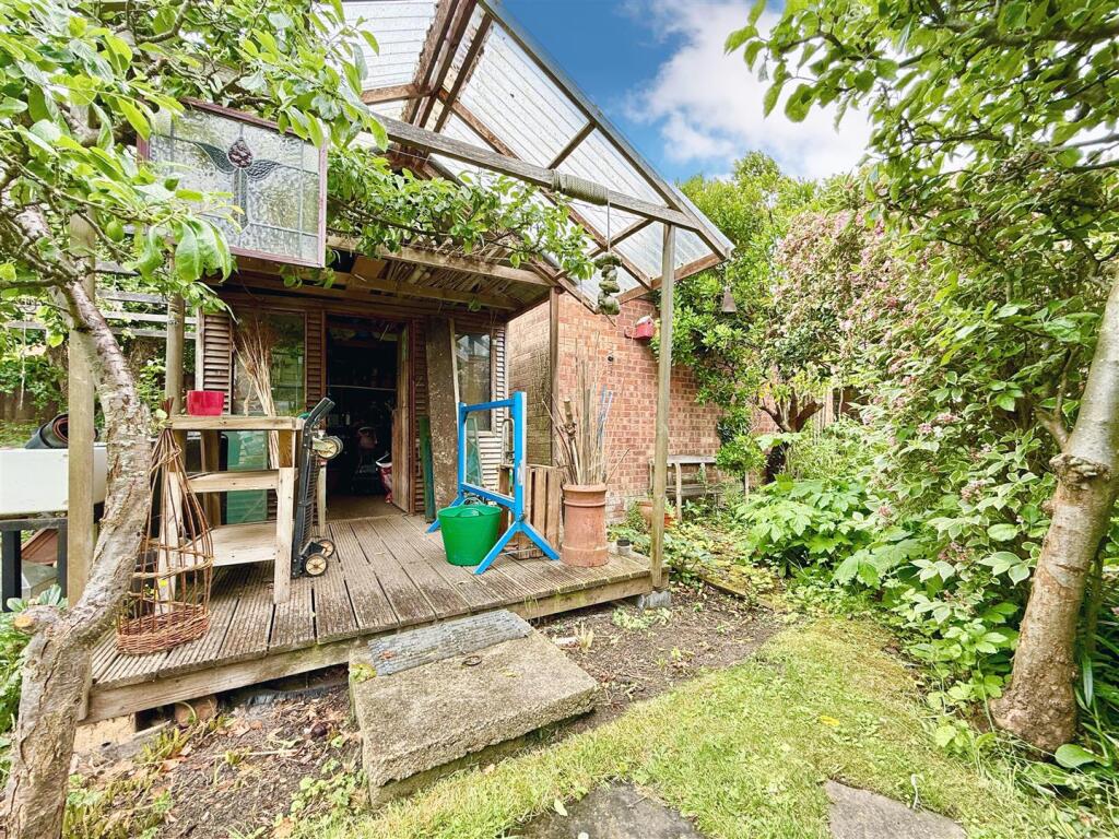 delightful garden workshop with veranda