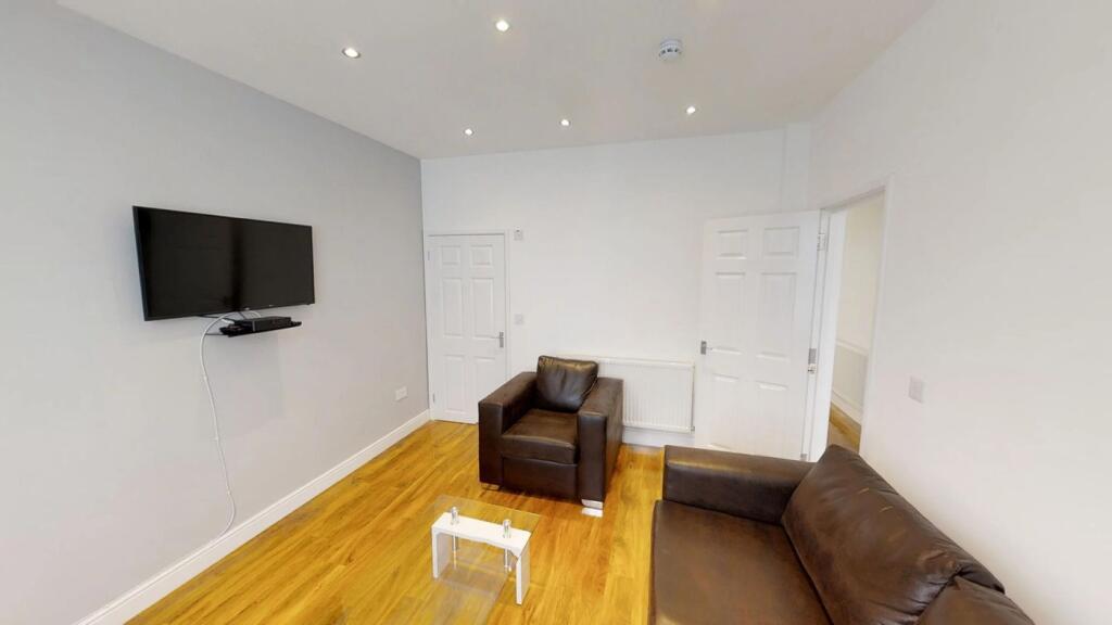 This inviting living room features stylish seat...