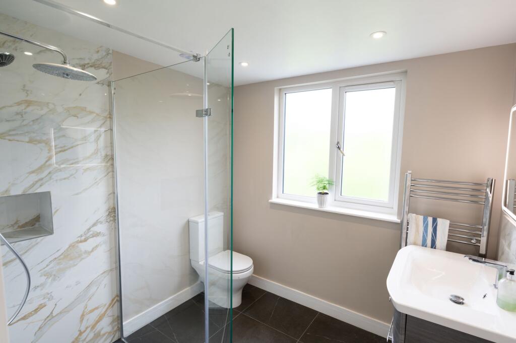 Four double bedrooms and two bathrooms