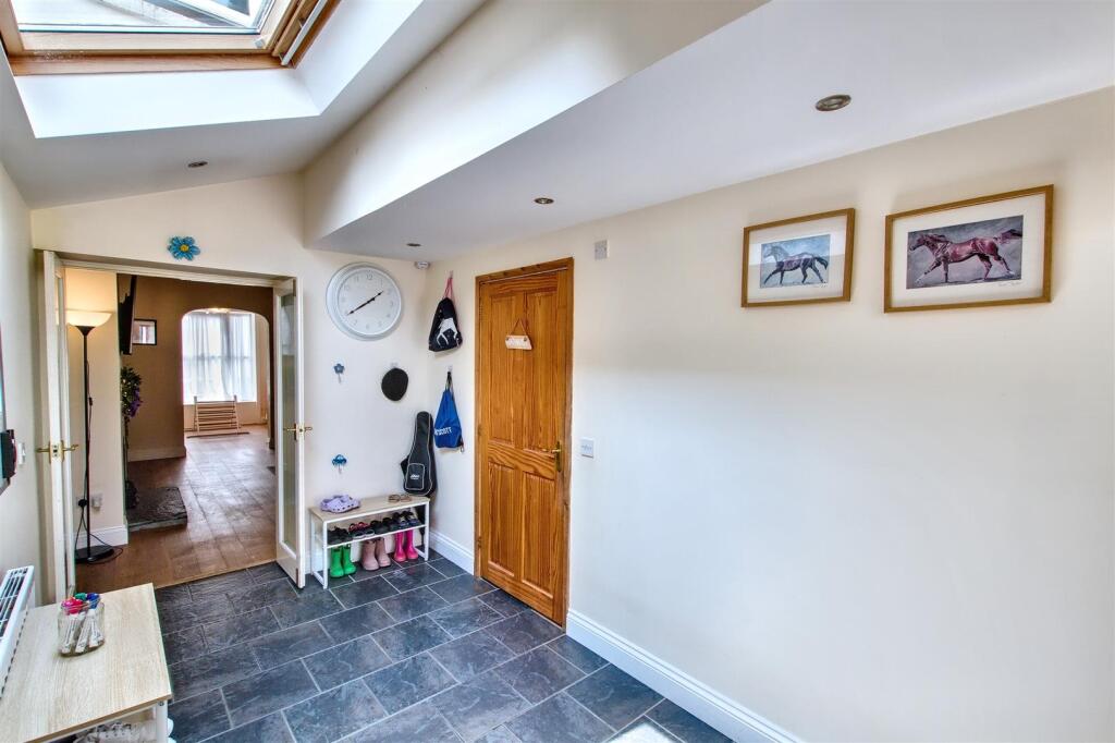 Area leading to Kitchen and Bathroom