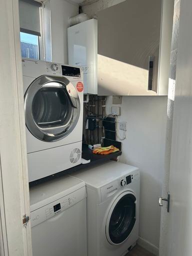 A modern, well-maintained bathroom with a washi...