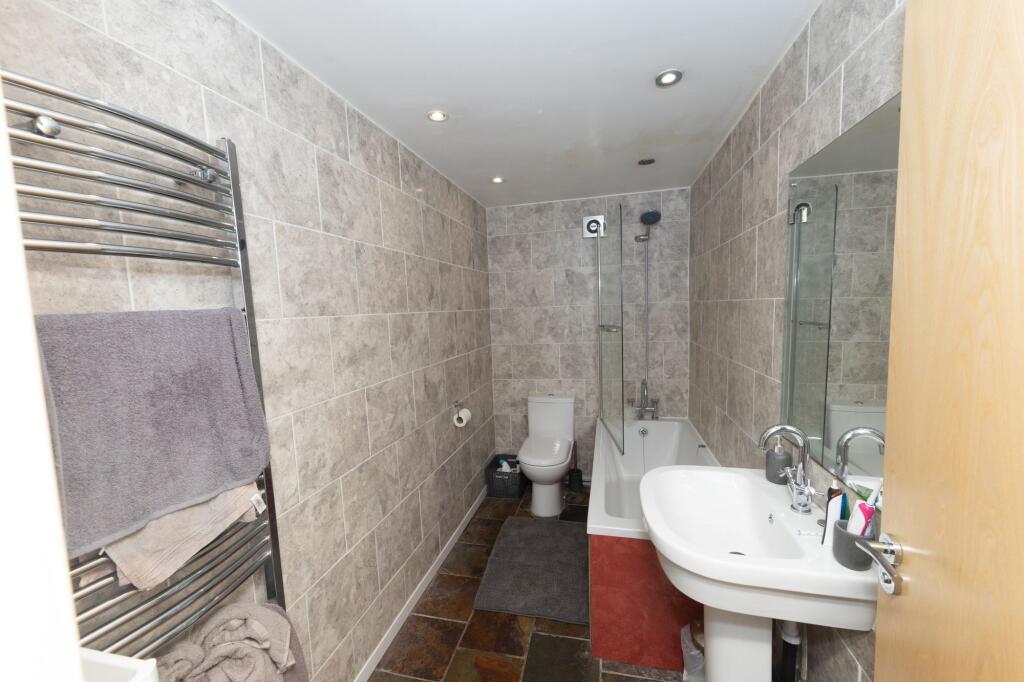 A modern, well-maintained bathroom featuring a ...