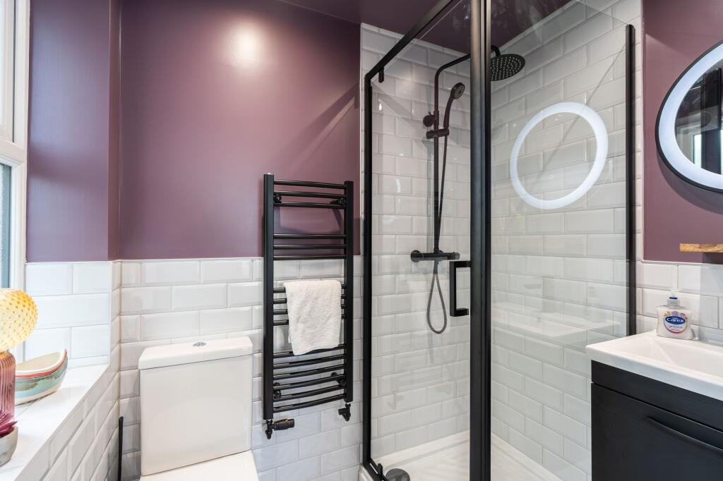 Modern and stylish bathroom featuring a sleek w...