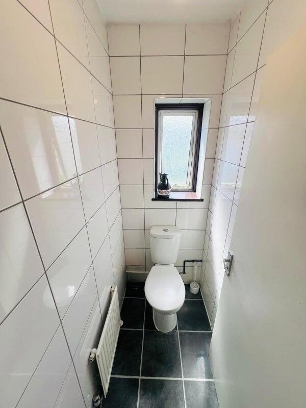 A clean and well-maintained single toilet featu...