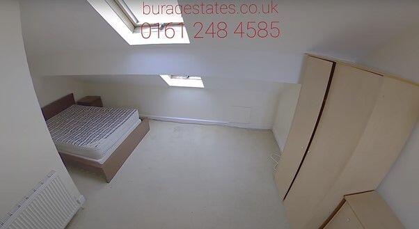 A bright and clean single bedroom featuring a c...