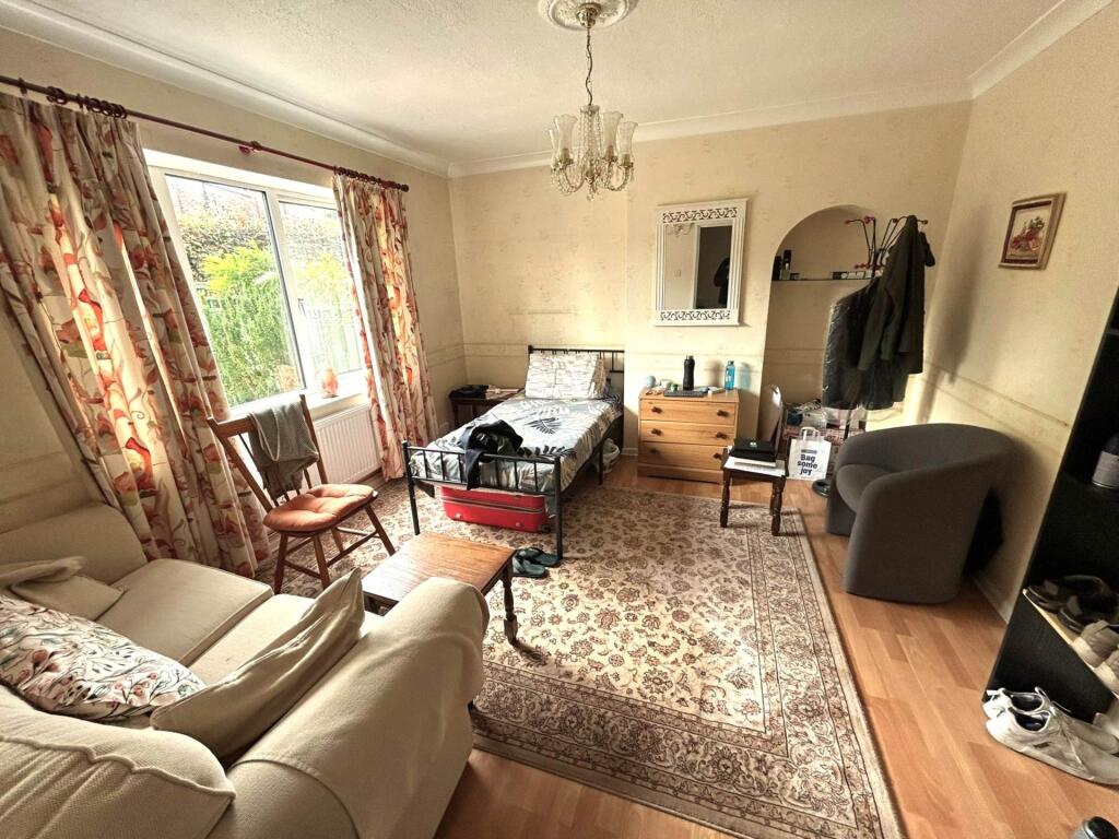 Bright, comfortably furnished living room with ...