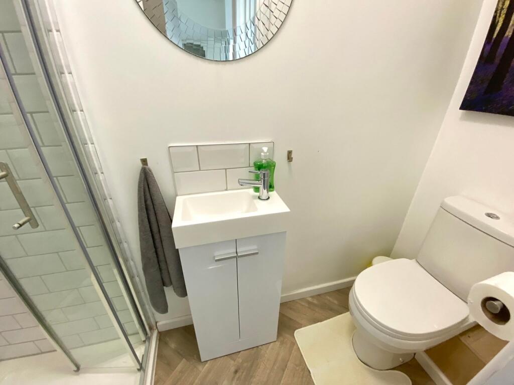 A modern and clean bathroom featuring a spaciou...
