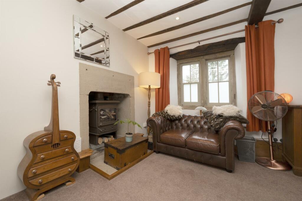 Bedroom One - fireplace and seating.jpg