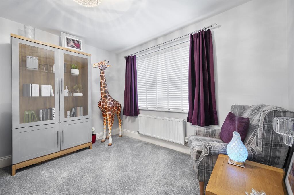 Living Room - giraffe and cabinet.jpg