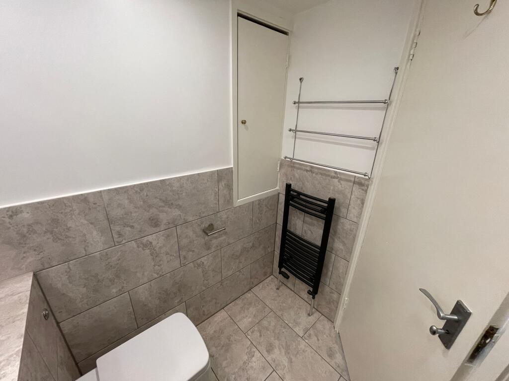 A clean and well-maintained single toilet room ...
