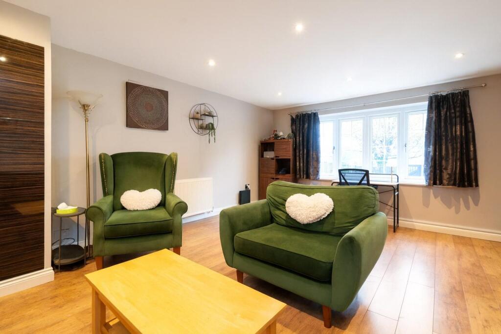 Spacious Living Room with Velvet Armchairs.jpg