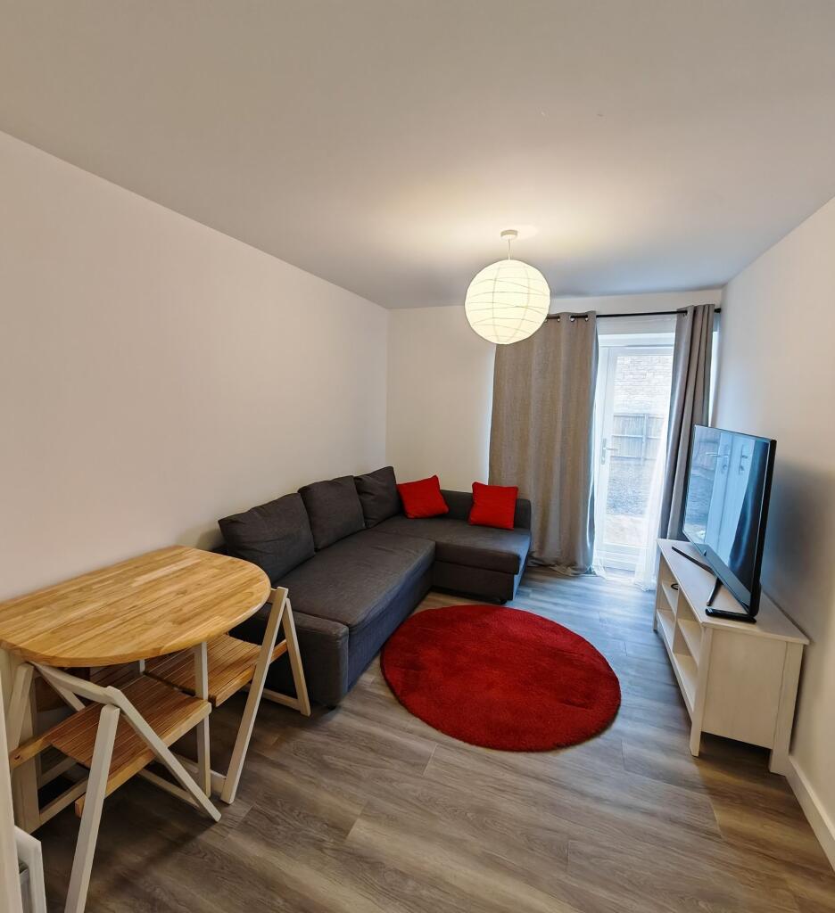 A modern living room featuring a comfortable da...