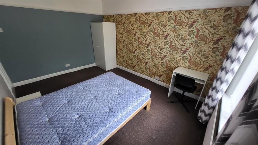 A modest single toilet area with a visible toil...