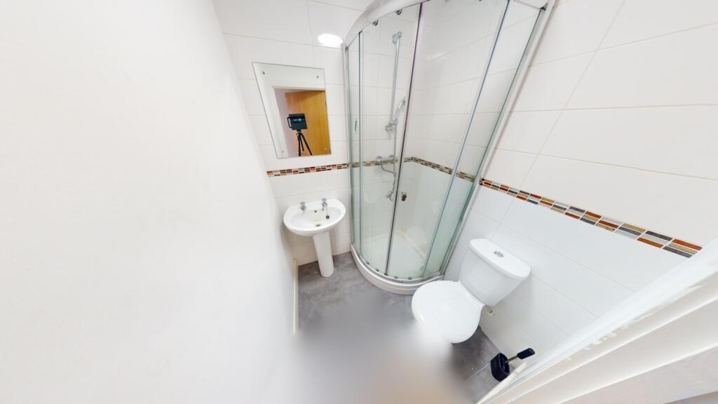 Bright and clean bathroom featuring a modern cu...