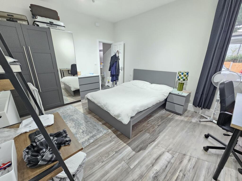 Bright and modern double bedroom featuring a co...