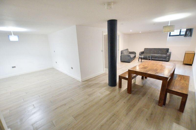 Bright and spacious living room featuring moder...