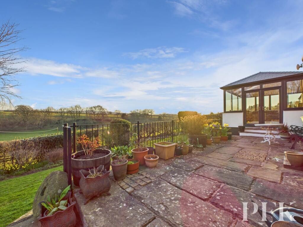 Rear patio and sun room