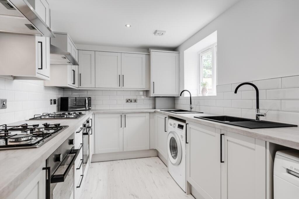 A modern and clean kitchen with ample space and...