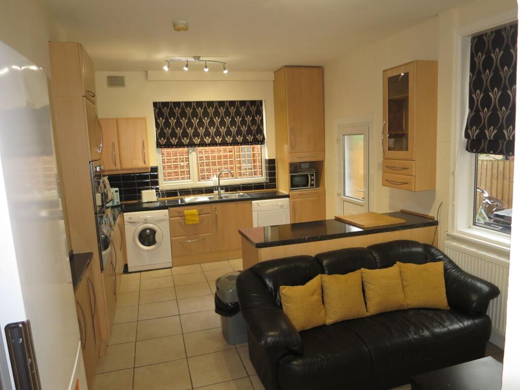 Bright and well-organized kitchen with modern c...