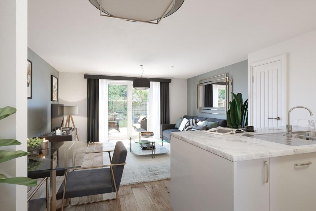 The open plan living area features double doors to the garden