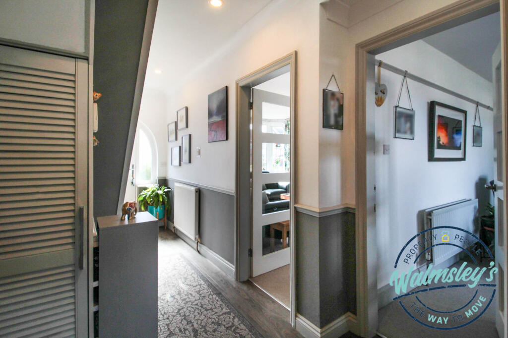 Hallway with glazed doors to reception room