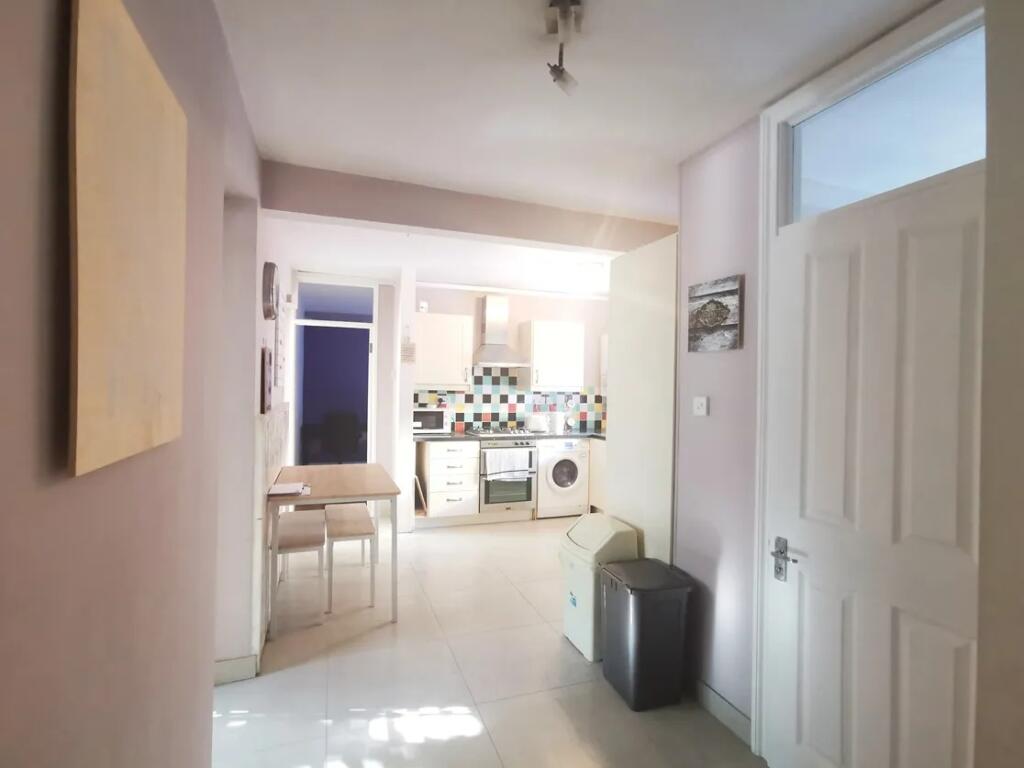 Bright and tidy kitchen space featuring modern ...