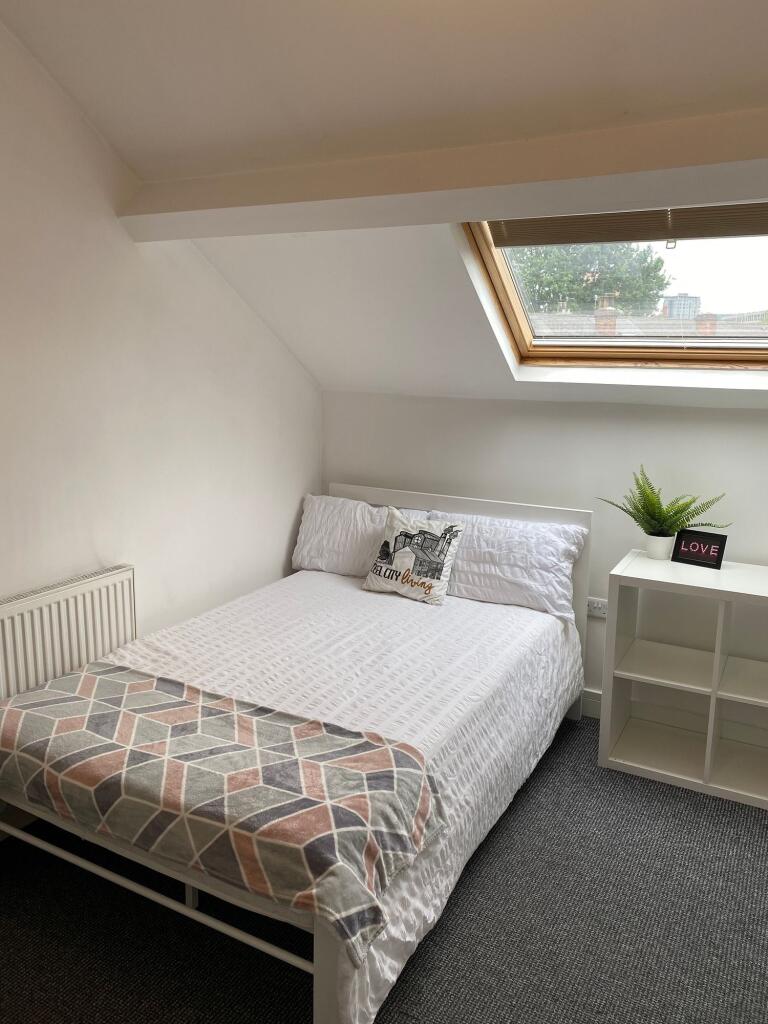 Bright and inviting double bedroom featuring a ...