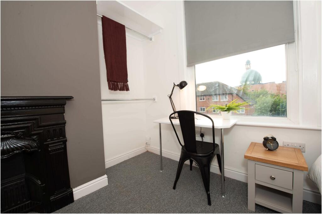 A well-maintained living room featuring a large...