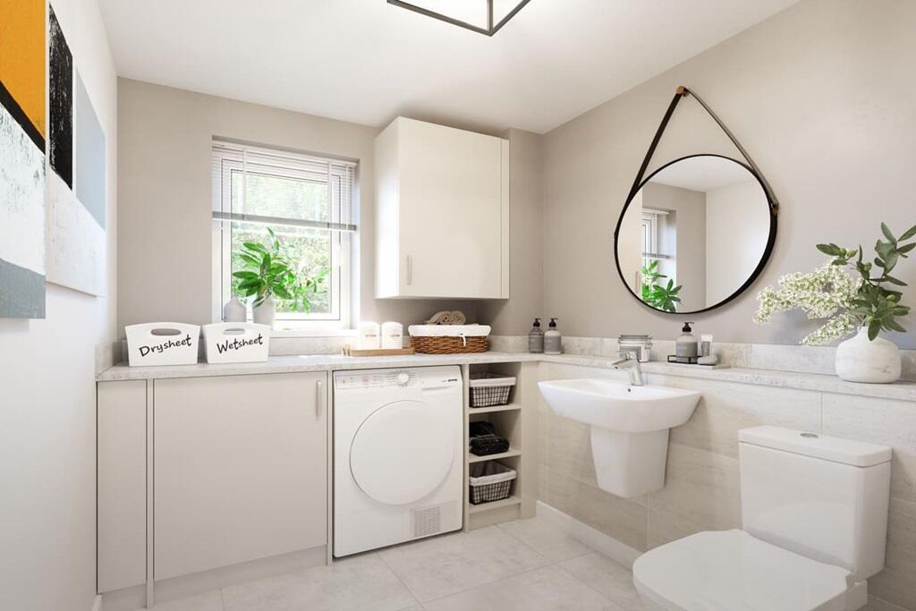 Convenient utility/cloakroom is tucked behind the stairs