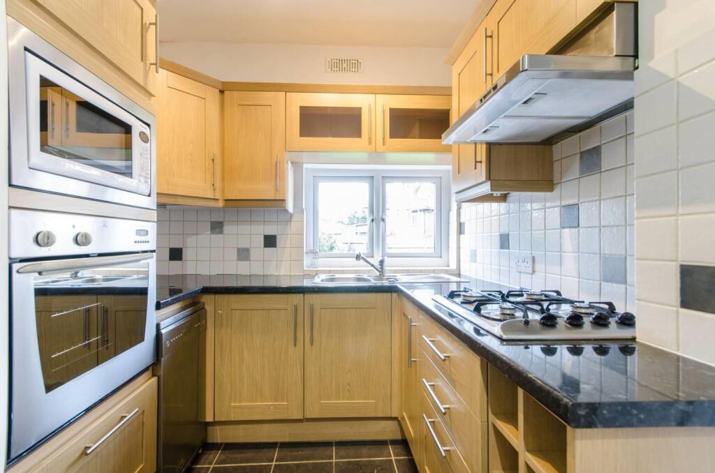 Double oven in modern  sizeable fitted kitchen