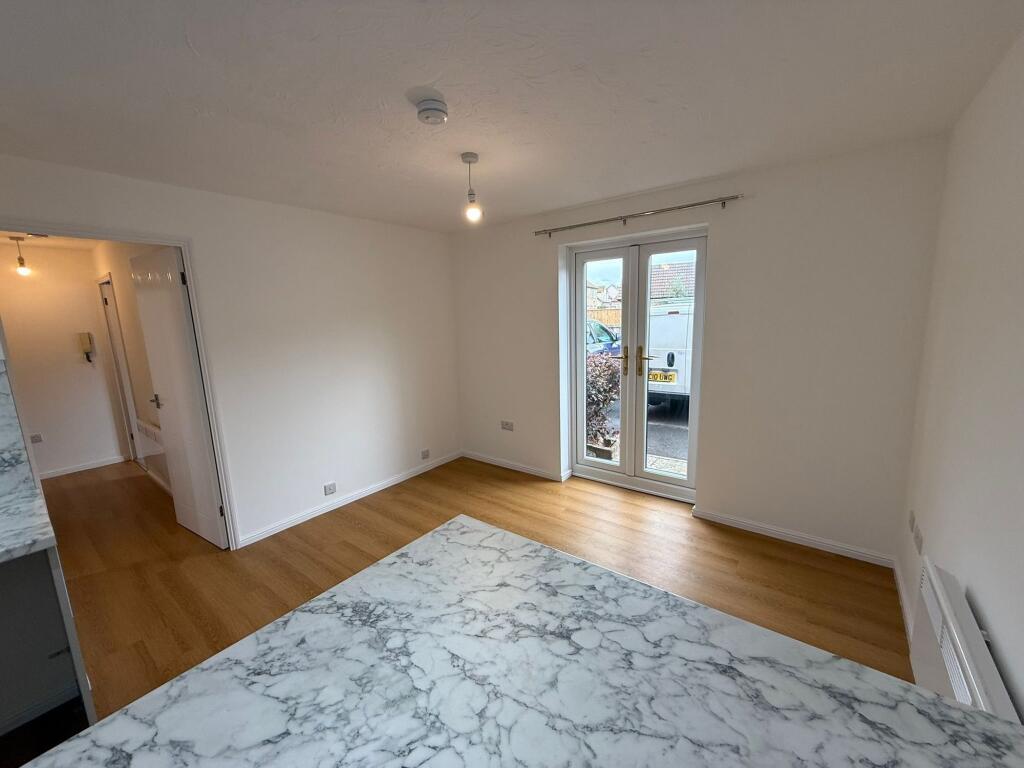 Bright and spacious living room with large doub...