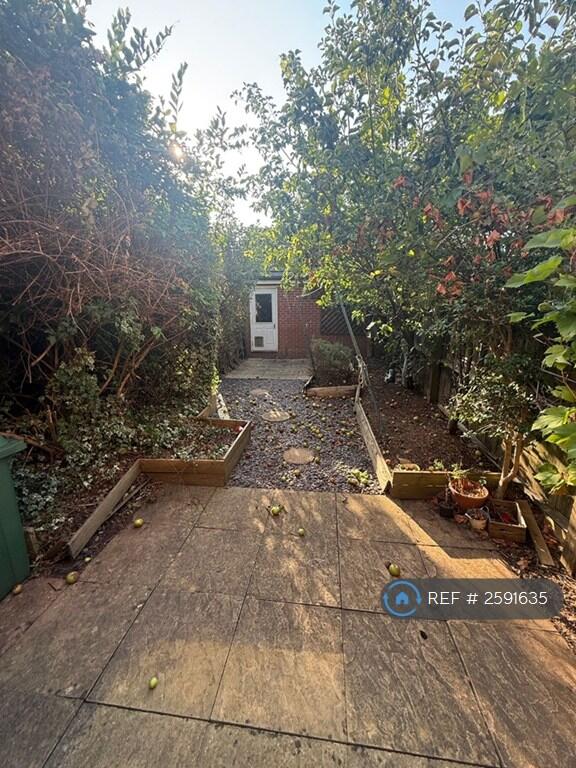 Back Garden With Garage Access