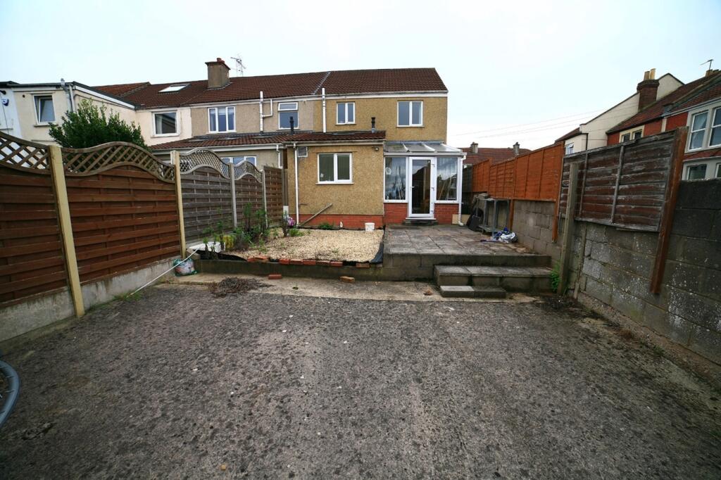 A spacious garden area featuring a mix of natur...