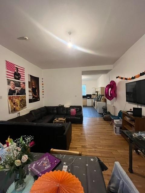 A modern, spacious living room featuring contem...