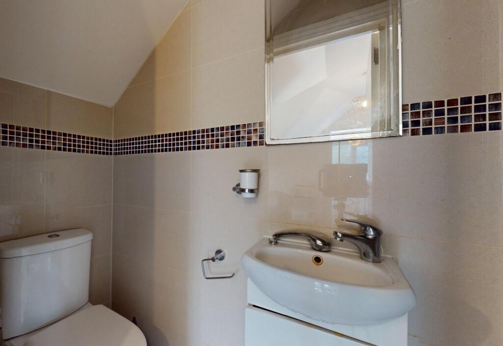 A clean and well-maintained single toilet featu...